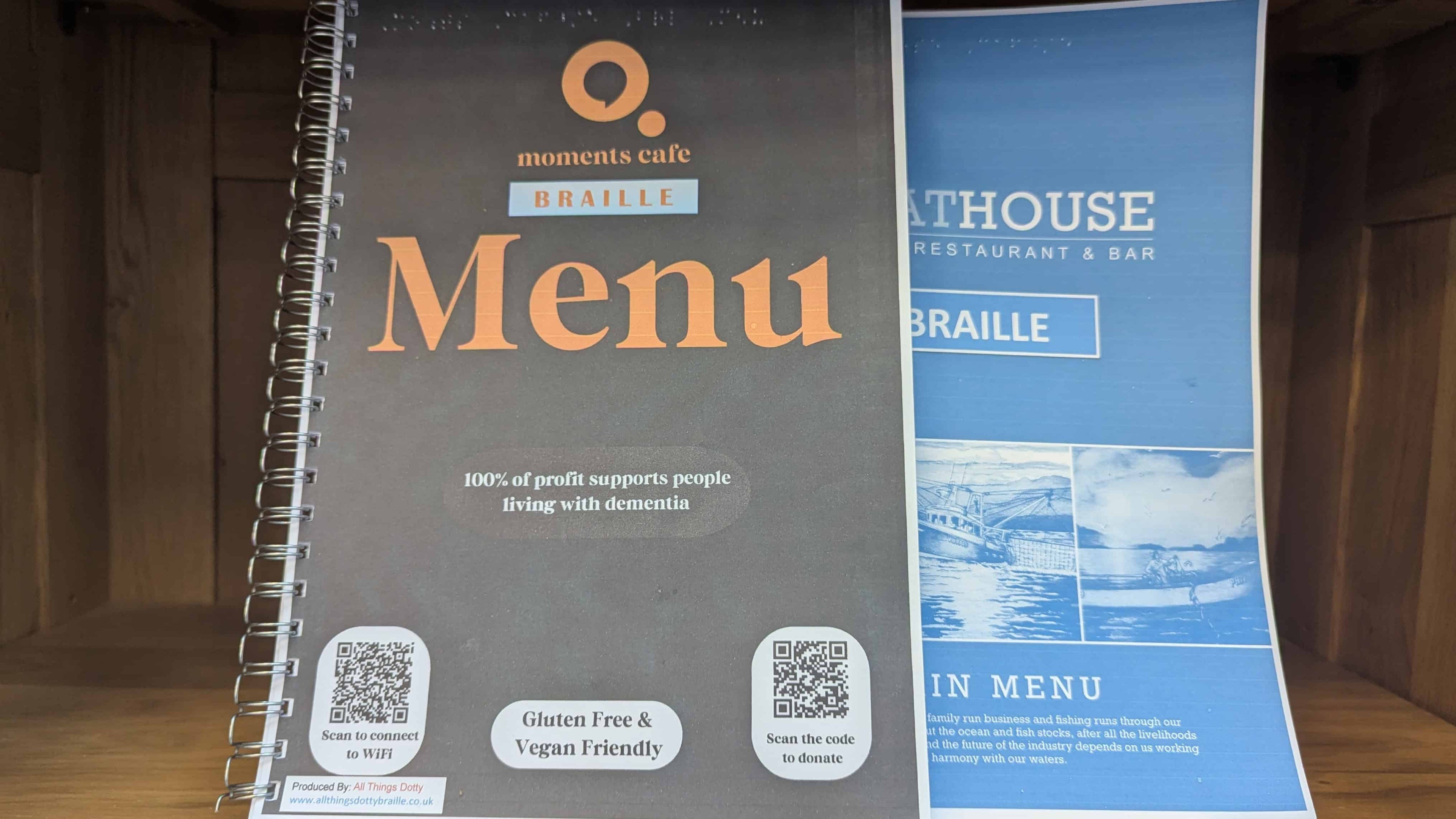 A photo of two Braille menus