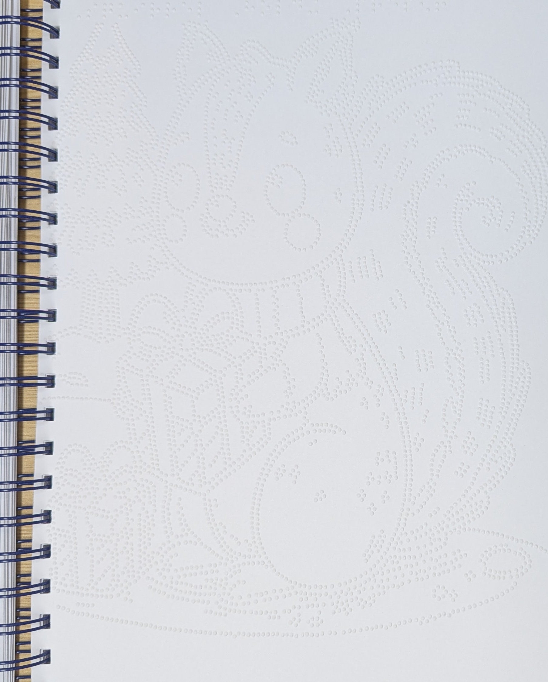 a close up braille image page showing a braille Christmas cat design.