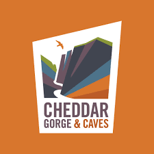 Logo for Cheddar Gorge & Caves with a stylized illustration of cliffs on an orange background.
