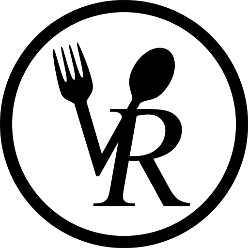 Logo for The Village restaurant; with a fork and spoon forming the letters 'VR' inside a circle.